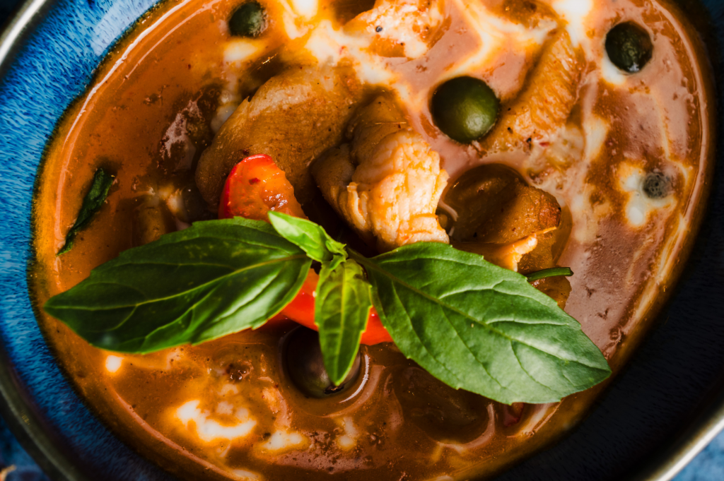 Top down of a chicken panang curry.