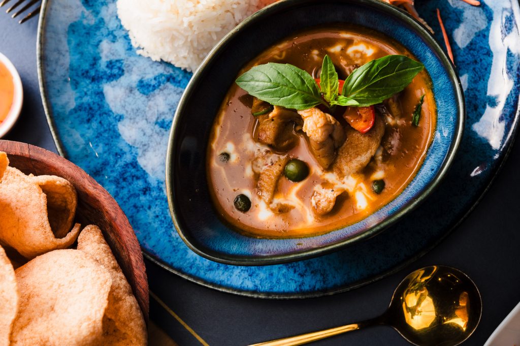Penang curry with chicken and a side of thai prawn crackers and jasmine rice